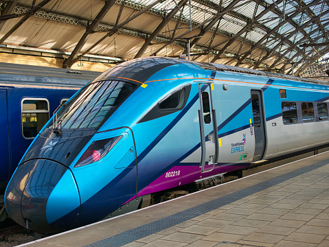 Liverpool, UK - Nov 21 2023: The engine of a TransPennine Express train at Lime Street Station in Liverpool, UK. The train is waiting for passengers to arrive before departing for Newcastle.