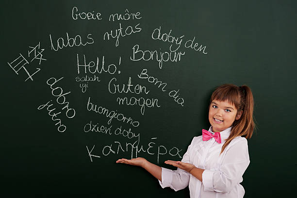 istock Schoolgirl presenting foreign phrases on blackboard 186969221
