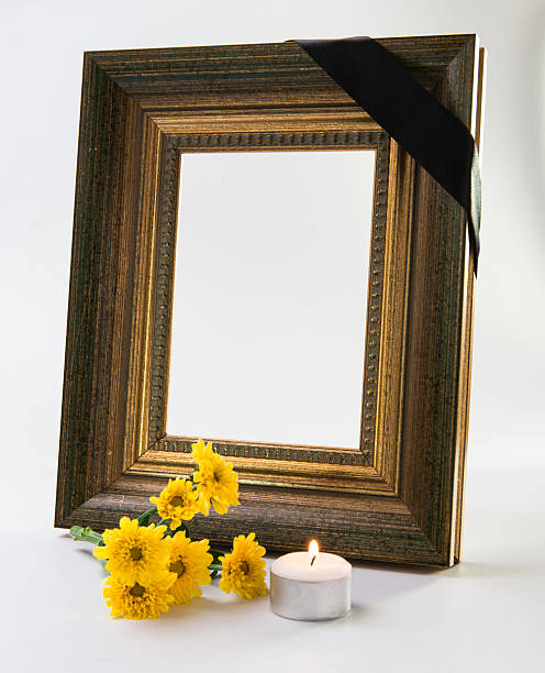 thick gold frame with candle thick gold frame with yellow chrysanthemum and candle isolated on white memorial event photos stock pictures, royalty-free photos & images