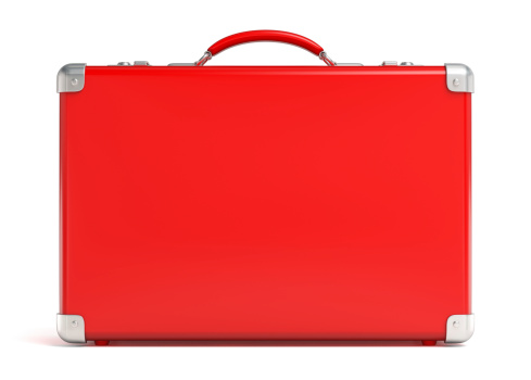 A singular red suitcase on white