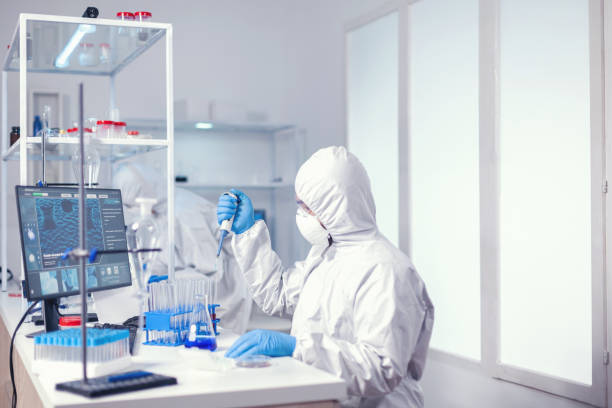 istock Medical scientist preparing sample with automatic pipette 1869699126