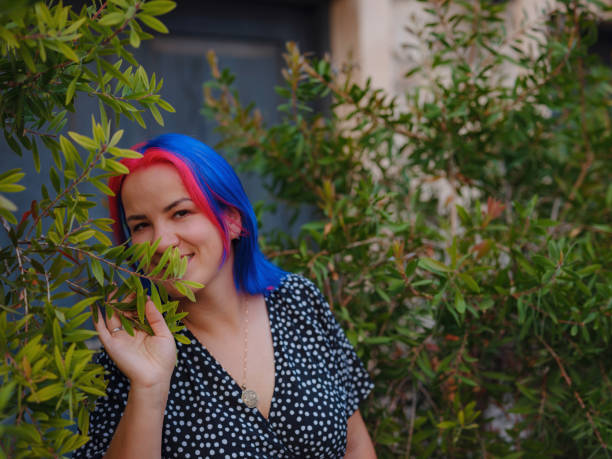 female summer old town walk in Antalya Turkey. woman with colorful hair and dress gracefully explores its historic streets. creating visual symphony that harmonizes past and present.