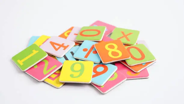 Photo of Number wood block cubes for learning Mathematic, education math concept.