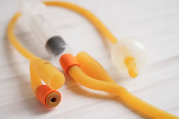 Foley catheter and urine drainage bag collect urine for disability or patient in hospital.