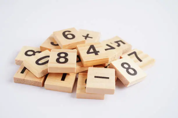 Photo of Number wood block cubes for learning Mathematic, education math concept.