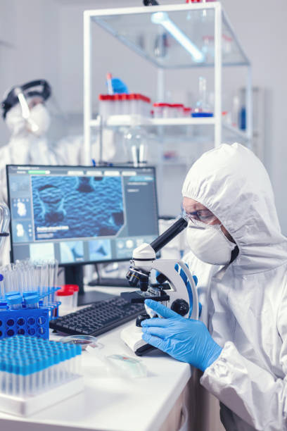 istock Medic and nurse dressed in ppe equipment checking evolution of coronavirus 1869707834