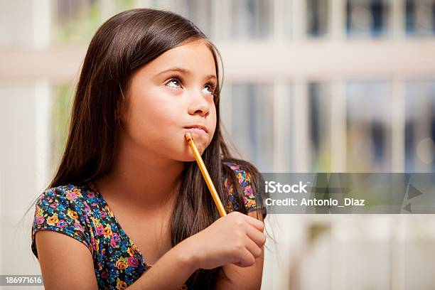 Solving A Problem For Homework Stock Photo - Download Image Now - Beautiful People, Beauty, Brown Hair