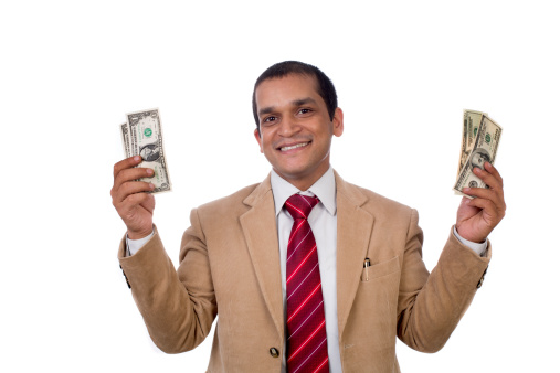 Happy Businessman with Money or Dollars in hands. Isolated on white background.