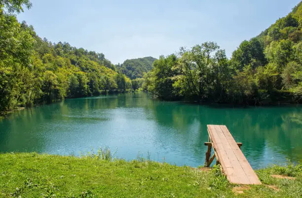 A wooden diving board on the River Una near Orasac, Bihac, in the Una National Park. Una-Sana Canton, Federation of Bosnia and Herzegovina. Early September