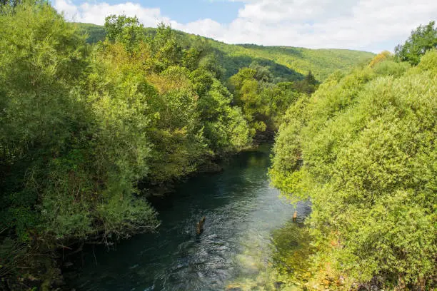 The River Unac as it flows through Martin Brod, Bihac, in the Una National Park. Una-Sana Canton, Federation of Bosnia and Herzegovina. Early September
