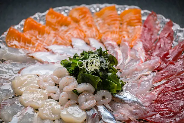 Sashimi plate with tuna fish,swordfish,shrimps, prawns,salmon,octopus,sardines and origami