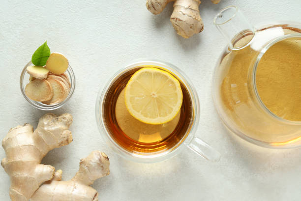 istock Cup and teapot with tea, ginger on white background, top view 1869727541