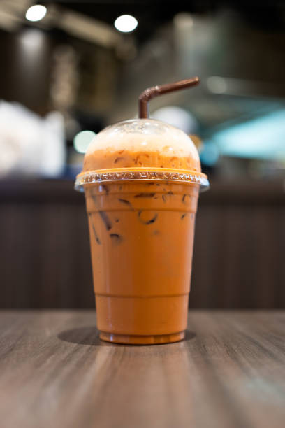 istock Thai milk tea in glass on the table. 1869735256