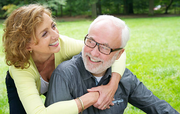 istock Happy older couple laughing outdoors 186974554