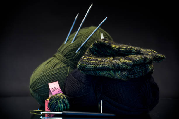 istock wool yarn, knitting needles and other tools for hand knitting. 1869754184