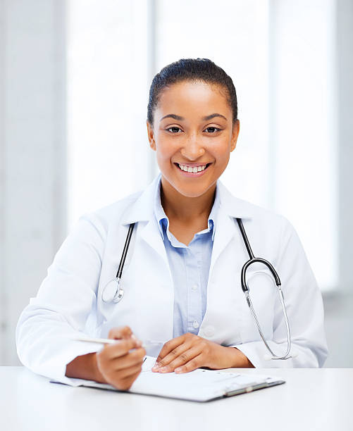istock female doctor writing prescription 186975683