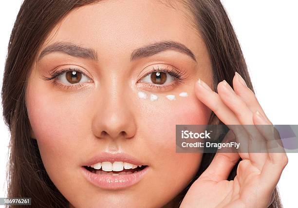 Woman Applying Moisturizing Cream Stock Photo - Download Image Now - Eye, Moisturizer, 20-24 Years