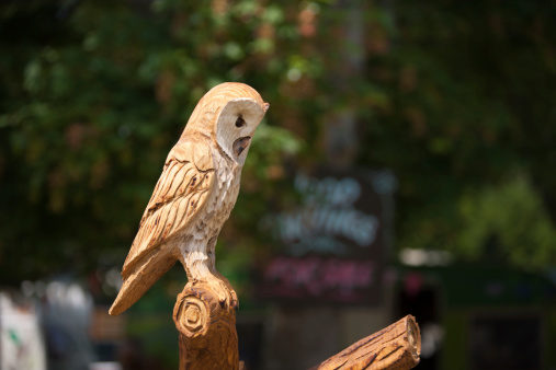 Chainsaw-Carved wooden owl on display at a country show in the Cotswolds