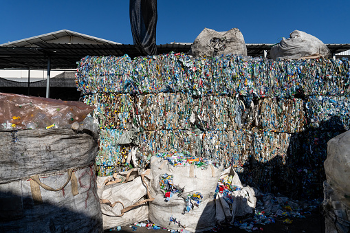 Large bales of platic are stacked at a sorting and compacting facility in Bang Phli, Samut Prakan, Thailand on December 20, 2023. Thailand is one of the world's biggest polluters. Out of the 8 million tons of waste the country generates, only 25% is recycled, and over 50,000 tons end up in the ocean every year. However, the Thai Government implemented a plan to ban all plastic imports by 2025, which has already resulted in a decrease in imported plastic into the Kingdom, which imported 180,000 tons in 2022.