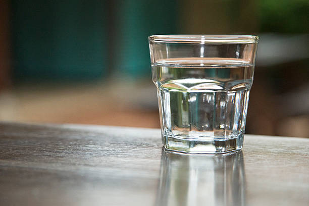 istock Glass of Water on a Table 186977077