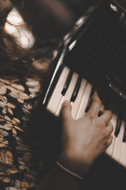 istock A woman playing the accordion. 1869780104