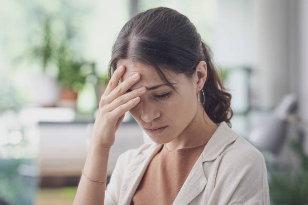 istock Stressed sad woman posing indoors 1869786189