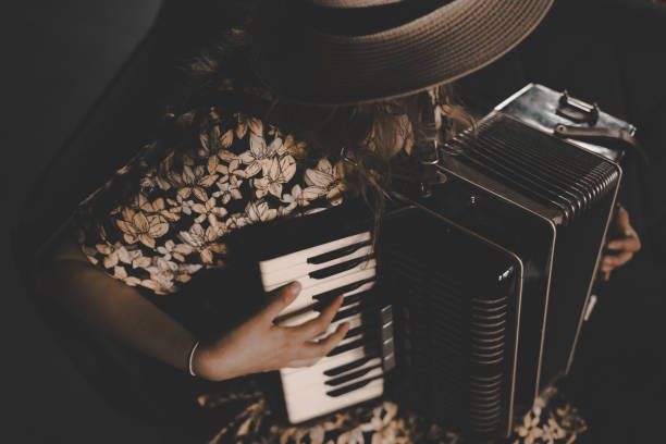A woman playing the accordion.