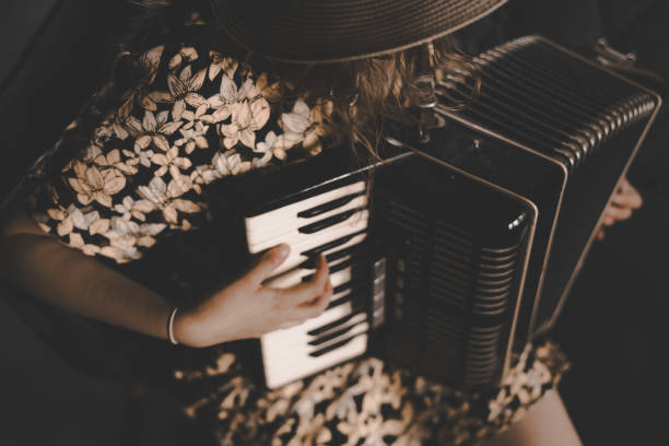 istock A woman playing the accordion. 1869790434