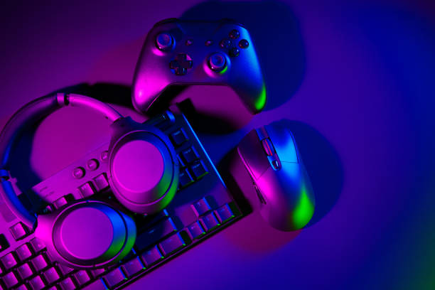 istock Headphones, computer mouse and keyboard on black background 1869792895