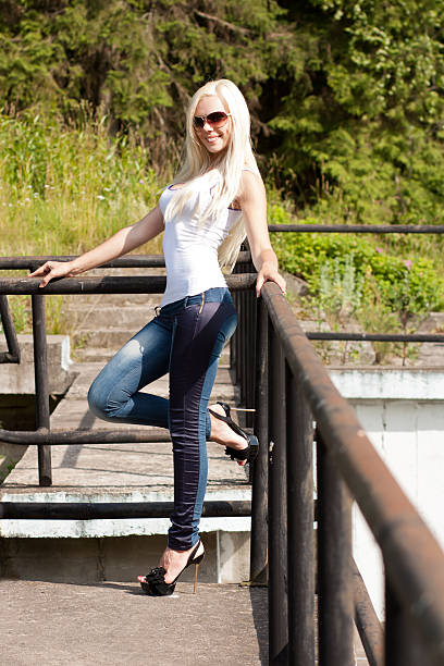 istock Smiling blond girl in sun glasses 186980609