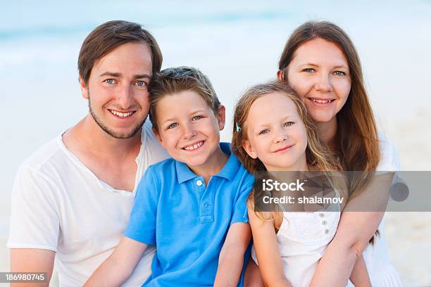 Family On A Tropical Beach Vacation Stock Photo - Download Image Now - Adult, Boys, Brother