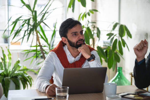 istock Mixed-Race Worker Listening Attentive To His College Explanation 1869809563