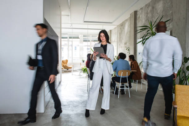 istock Pretty Caucasian Woman Using Her Tablet At The Office 1869810106