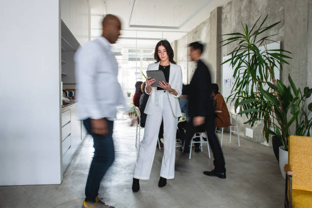 istock Attractive Caucasian Woman Using Her Tablet At The Office 1869810107