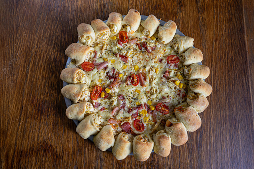 Delicious pizza with cheese-filled crust, a mouthwatering treat for cheese lovers.