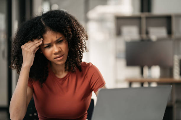 istock Stress businesswoman is sitting at table, under stress from working. 1869817220