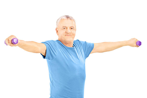 istock Mature man in blue shirt exercise with dumbbells 186981777
