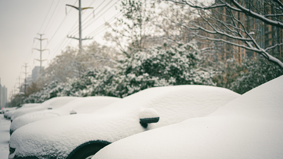 Vintage car covered in snow, New York City, USA