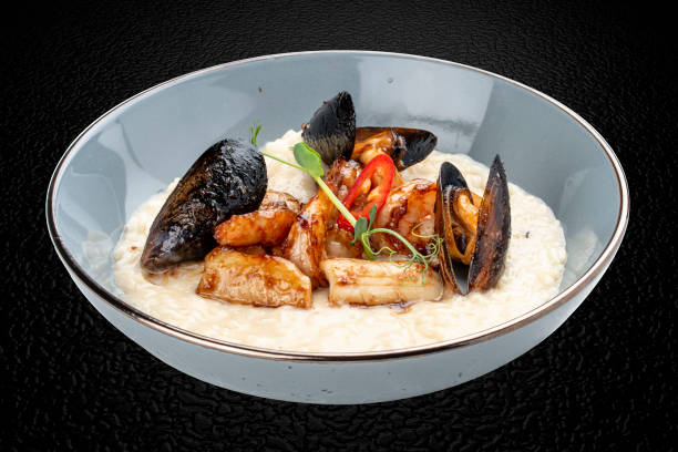 istock Risotto with seafood: shrimp and mussels. Isolated image 1869840744