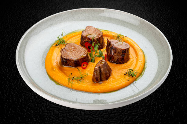 istock Pork loin on mashed yams. Isolated image 1869840750