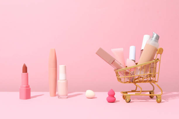 istock Golden shopping basket with pink makeup accessories 1869844494