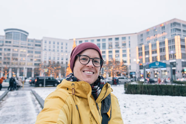 Woman taking a selfie on the streets of Berlin