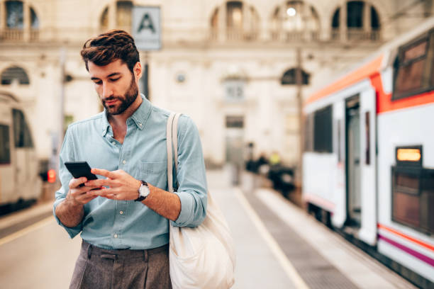istock Young confident businessman at subway station 1869869720