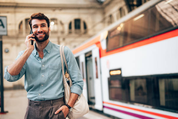istock Young confident businessman at subway station 1869869732
