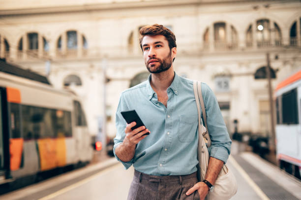 Young confident businessman at subway station