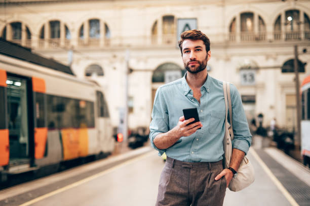 istock Young confident businessman at subway station 1869869751
