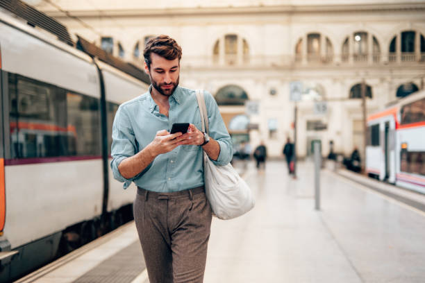 istock Young confident businessman at subway station 1869870779