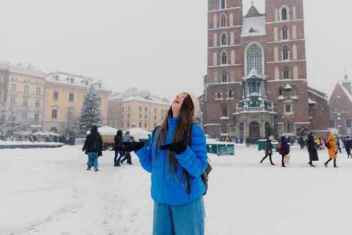 Moscow, Russia - December 10, 2017. People are walking pass State Historical Museum to Saint Basil's Cathedral on Red square.