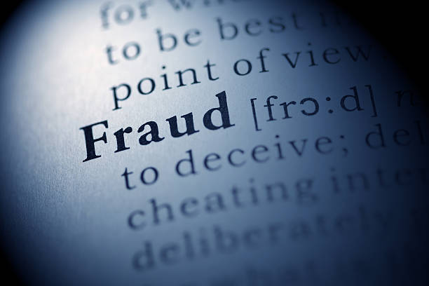 istock Picture of a dictionary page explaining the word fraud 186987572