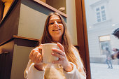 Woman Enjoying Winter Time With Coffee at Cafe